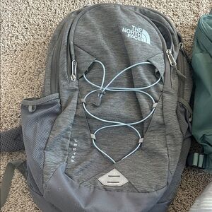 The North Face Jester Dark Gray Backpack with Blue Accents